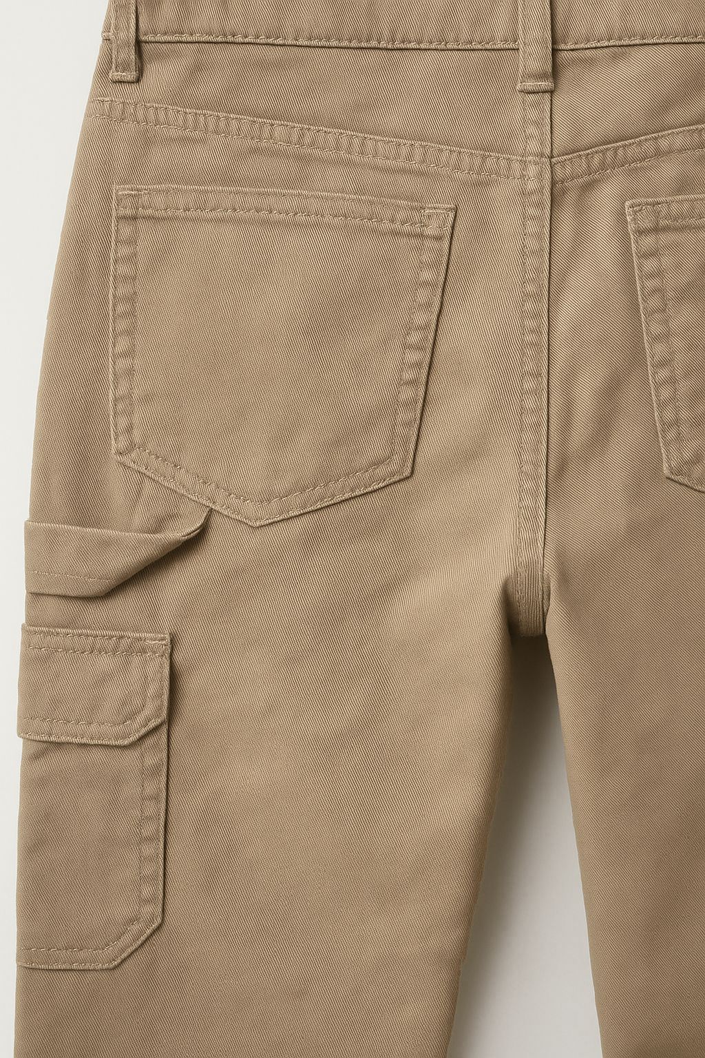 Rear view of women’s handmade khaki utility pants with dual back and cargo pockets