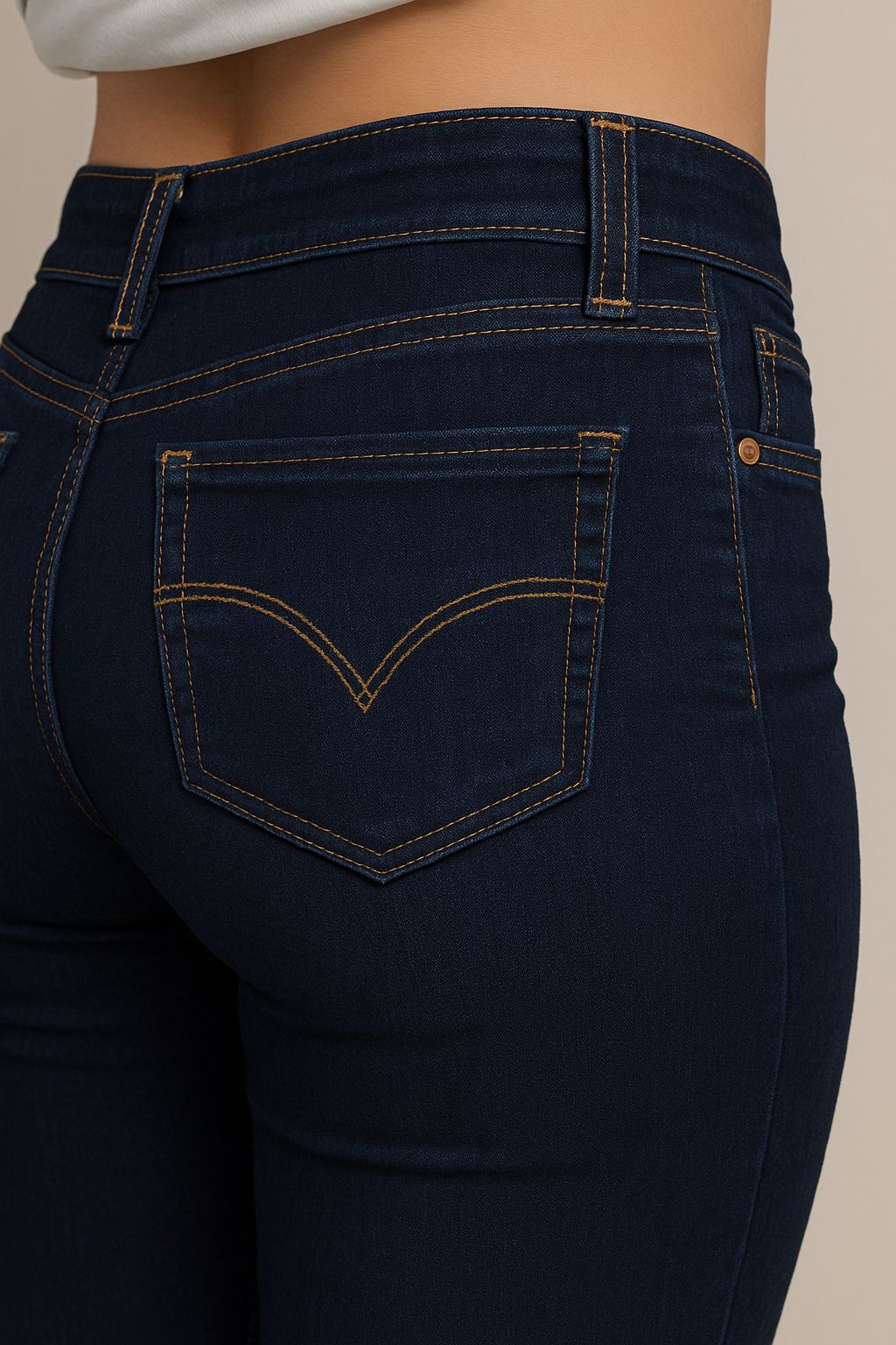 Close-up rear view of women’s handmade denim jeans with contrast stitching